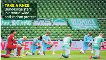  ??  ?? TAKE A KNEE Bundesliga stars join world-wide anti-racism protest