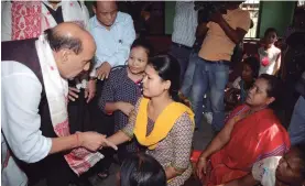  ?? — PTI ?? Union home minister Rajnath Singh talks to flood- affected people at a relief camp in Bhakat Gaon, in Morigaon district of Assam, on Saturday.