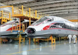  ?? LI ZIHENG / XINHUA ?? A high-speed train production line of China Railway Rolling Stock Corp in Qingdao, Shandong province.