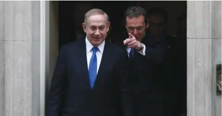  ?? (Reuters) ?? PRIME MINISTER Benjamin Netanyahu walks out of 10 Downing Street after his meeting with Britain’s Prime Minister Theresa May in London on Monday.