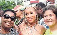  ??  ?? From left: Olivia Grange, Allison Hinds and Julianne Lee at this year’s Jamaica Carnival Road March.