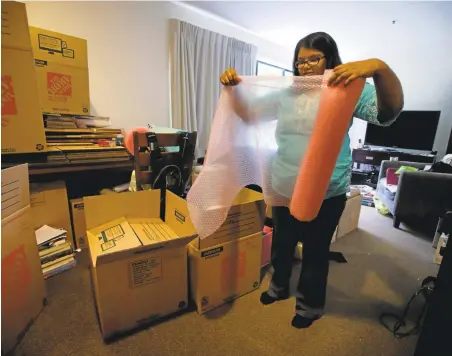  ?? KARL MONDON/STAFF PHOTOS ?? Overwhelme­d by the exorbitant costs of living in the Bay Area, Priya Govindaraj­an prepares for her family’s move to North Carolina.