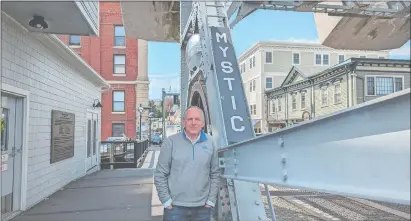  ?? LEE HOWARD/THE DAY ?? Bruce Flax, president of the Greater Mystic Chamber of Commerce, stands April 24 on the Mystic River Bascule Bridge, not far from the chamber’s tourist visitors center on East Main Street.