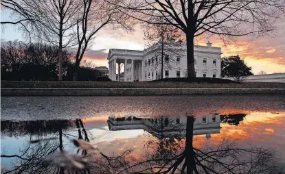  ?? [AP PHOTO] ?? The sun rises behind the White House on Saturday in Washington.