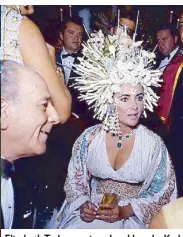  ??  ?? Elizabeth Taylor wearing a headdress by Karl Lagerfeld in the movie Boom (1968)