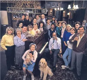  ??  ?? The cast of BBC TV series Eastenders in the Queen Vic pub 1985.