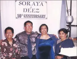  ??  ?? Flanked by his mother-in-law, Soundthree Naidoo, left, and his mom Meera, far right, at the couple’s 10th wedding anniversar­y in 2004.