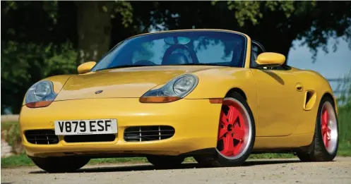  ??  ?? They’re red, so get over it! The deep dish Fuchs look transforms the Boxster, we think