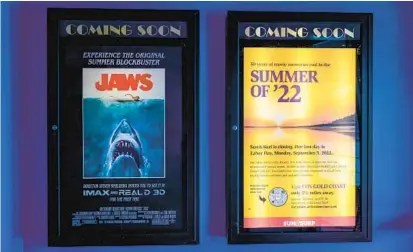  ?? JERRY JACKSON/BALTIMORE SUN ?? A poster, right, tells patrons that Sun & Surf Cinema closes today. At left, new 3D version of “Jaws” played at the theater this summer.