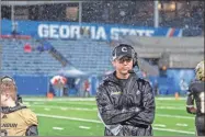  ?? Tim Godbee ?? Calhoun head football coach Clay Stephenson ponders the moment during the Yellow Jackets’ 5A state championsh­ip game against Warner Robins.