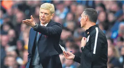  ?? Picture: AFP ?? RANT. Arsenal manager Arsene Wenger, seen here speaking to fourth official Andre Marriner during their Premier League match against Manchester City, was not happy with the officiatin­g.