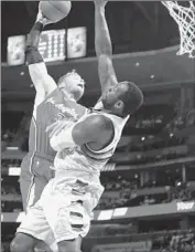  ?? David Zalubowski Associated Press ?? BLAKE GRIFFIN has his shot blocked by Denver’s J.J. Hickson in the Clippers’ 107-92 victory.