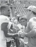  ?? BRYNN ANDERSON/AP ?? Dolphins safety Minkah Fitzpatric­k, who is seeking a trade, greets fans before Sunday’s 59-10 loss to Baltimore.