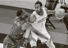  ?? Jason Miller / Getty Images ?? The Rockets will consider whether to change their pattern of resting John Wall, working against the Cavaliers’ Damyean Dotson, in one half of back-to-backs.