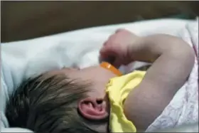  ?? AP PHOTO/TIMOTHY D. EASLEY ?? In this Feb. 13, 2018 file photo, a week-old baby lies in a neonatal intensive care unit bay at the Norton Children’s Hospital in Louisville, Ky. This particular NICU is dedicated to newborns of opioid addicted mothers, that are suffering with newborn abstinence syndrome. A study in Tennessee released on Thursday, Aug. 30, 2018, found learning disabiliti­es and other special education needs are more common in young children who were born with symptoms from their mothers’ prenatal opioid use.