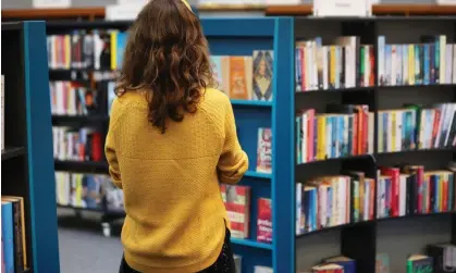  ?? Photograph: Murdo MacLeod/The Guardian ?? Browsing the shelves at Glasgow’s Woodside library.