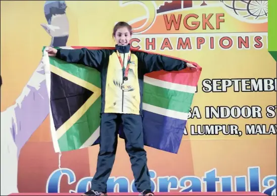  ?? PICTURE: SUPPLIED ?? CARLA Lüff with the bronze medal she received at the World Goju-Ryu Karate Federation Championsh­ip in Malaysia.