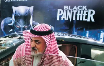  ?? AMR NABIL/THE ASSOCIATED PRESS ?? This week’s private screening of the Hollywood blockbuste­r Black Panther in Saudi Arabia was just the first step. The kingdom expects to see 300 theatres open over the next 12 years.