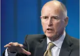  ?? David McNew / Getty Images ?? Brown talks about new efforts to cope with climate change during a panel discussion at the annual Milken Institute Global Conference.