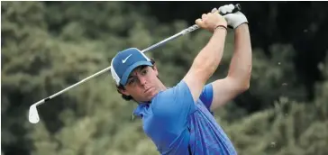  ?? Andrew Redington/AFP/Getty Images ?? Rory McIlroy of Northern Ireland hits a shot Wednesday ahead of the 142nd Open Championsh­ip at Muirfield.