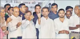  ?? PTI PHOTO ?? The CPI(M)’s Sitaram Yechury, the TMC’s Dinesh Trivedi, the LJD’s Sharad Yadav, Congress president Rahul Gandhi, the RJD’s Tejashwi Yadav and the CPI’s D Raja during a candleligh­t vigil by Opposition leaders over the recent incidents of sexual violence in Bihar, in New Delhi on Saturday. &gt;&gt;P8