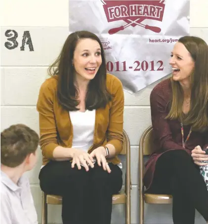  ?? STAFF PHOTO BY DAN HENRY ?? Battle Academy third-grade teacher Katelyn Baker, left, reacts Tuesday as she is announced as recipient of an unrestrict­ed $25,000 Milken Educator Award during an assembly.