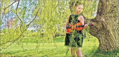  ?? SUBMITTED PHOTO ?? This young fi ddler, Amelia Parker from Nova Scotia, will be performing with the Prince County Fiddlers at their National Fiddle Day show at Britannia Hall in Tyne Valley on Saturday, May 19. She will also be playing a few solo tunes.