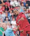  ?? ?? MANCHESTER City striker Erling Haaland (L) fights for the ball with Liverpool defender Joel Matip during the English FA Community Shield earlier in the season. The two teams clash in a league game tomorrow. | NIGEL RODDIS AFP