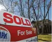  ?? Melissa Phillip / Staff photograph­er ?? A sold sign is shown at a home in the Memorial area.