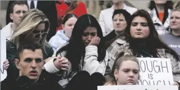  ?? AP PHOTO/PAUL SANCYA ?? Current and former Michigan State University students rally at the capitol in Lansing, Mich., on Wednesday.