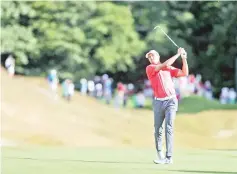  ??  ?? Jordan Spieth watches his second shot on the 12th hole during the second round of the Travelers Championsh­ip. - AFP photo