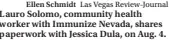  ?? Las Vegas Review-journal ?? Ellen Schmidt
Lauro Solomo, community health worker with Immunize Nevada, shares paperwork with Jessica Dula, on Aug. 4.