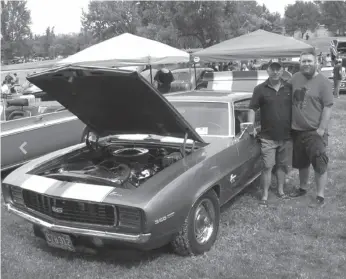  ?? CITIZEN PHOTO BY CHRISTINE HINZMANN ?? Simon, left, and son, Sean Dengel, stand beside Simon’s 1969 Camaro SS that Simon restored and then hot-rodded for a very special reason. The car was among more than 360 at the 44th annual Cruisin’ Classics Show ‘n’ Shine held at Lheidli T’enneh...