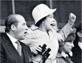  ?? ?? Enthusiast­ic: The Queen and Lord Porchester, her racing manager, watch the 1978 Derby