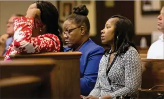  ?? ALYSSA POINTER / ALYSSA.POINTER@AJC.COM ?? Lynnette Allen (right), Fulton County’s new interim coordinato­r for the epidemic, listens during an opioid crisis forum in late June in Roswell City Council Chambers.