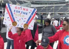  ??  ?? More than 4,500 Special Olympics athletes paraded through Soldier Field Thursday for the opening ceremonies of this year’s spring games.