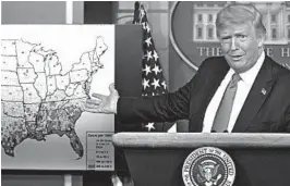  ?? DREW ANGERER/GETTY ?? President Donald Trump gestures to a map while speaking during a briefing Thursday at the White House on his administra­tion’s response to the coronaviru­s pandemic.