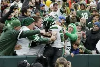  ?? MATT LUDTKE — THE ASSOCIATED PRESS ?? Jets running back Breece Hall jumps into the Jets’ fans area to celebrate his 34-yard rushing touchdown during the second half against the Packers on Sunday.