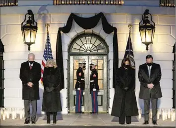  ?? Evan Vucci Associated Press ?? PRESIDENT BIDEN, First Lady Jill Biden, Vice President Kamala Harris and Second Gentleman Doug Emhoff pay tribute Monday at the White House to the 500,000 Americans who have died of COVID-19.