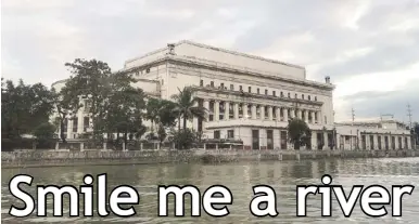  ?? Photos by JOANNE RAE RAMIREZ ?? A view of the Manila Post Office from the Pasig River.