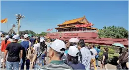  ??  ?? To Tiananmen with love: A large number of people from all parts of China visit the Square. For most, it's a dream-come-true visit.