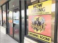  ?? Chris Bosak / Hearst Connecticu­t Media ?? The seasonal Spirit Halloween shop that will open soon in the Berkshire Shopping Center posted a “Now Hiring” sign in the window as of Thursday in Danbury.