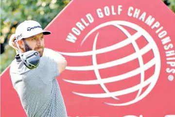  ?? — AFP photo ?? World number one Dustin Johnson tees off during the second round of the WGC-HSBC Champions at the Sheshan Internatio­nal golf club in Shanghai on October 27, 2017.