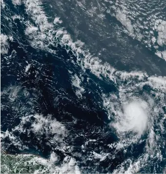  ?? GETTY IMAGES ?? BUILDING: Tropical Storm Gonzalo churns toward the Caribbean. The storm is expected to strengthen into the season’s first hurricane.