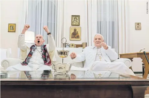  ??  ?? Jonathan Pryce, left, as Cardinal Bergoglio and Anthony Hopkins as Pope Benedict in The Two Popes.