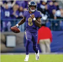  ?? PATRICK SMITH / GETTY IMAGES ?? Ravens rookie quarterbac­k Lamar Jackson, a first-round pick out of Louisville and the 2016 Heisman winner, ran 11 times for 77 yards in a 34-17 win over the Raiders on Sunday.