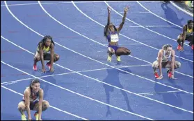  ?? CHANG W. LEE / THE NEW YORK TIMES ?? Ashley Spencer of the United States raises her hands at the women’s 400-meter hurdles final in Rio de Janeiro.