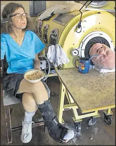  ?? Picture: Smiley N. Pool/The Dallas Morning News via AP ?? Paul Alexander drinking his coffee with his caregiver Kathryn Gaines.