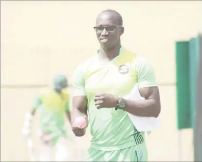  ??  ?? Guyana Jaguars’ Head Coach Rayon Griffith goes through some bowling drills with the pink ball and his bowlers at Providence yesterday