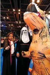  ??  ?? From top: People in costumes attend Middle East Film and Comic Con